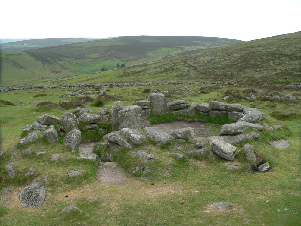 One of the huts at the Bronze-Age village of Grimspound, on Dartmoor photo by Pat Trout