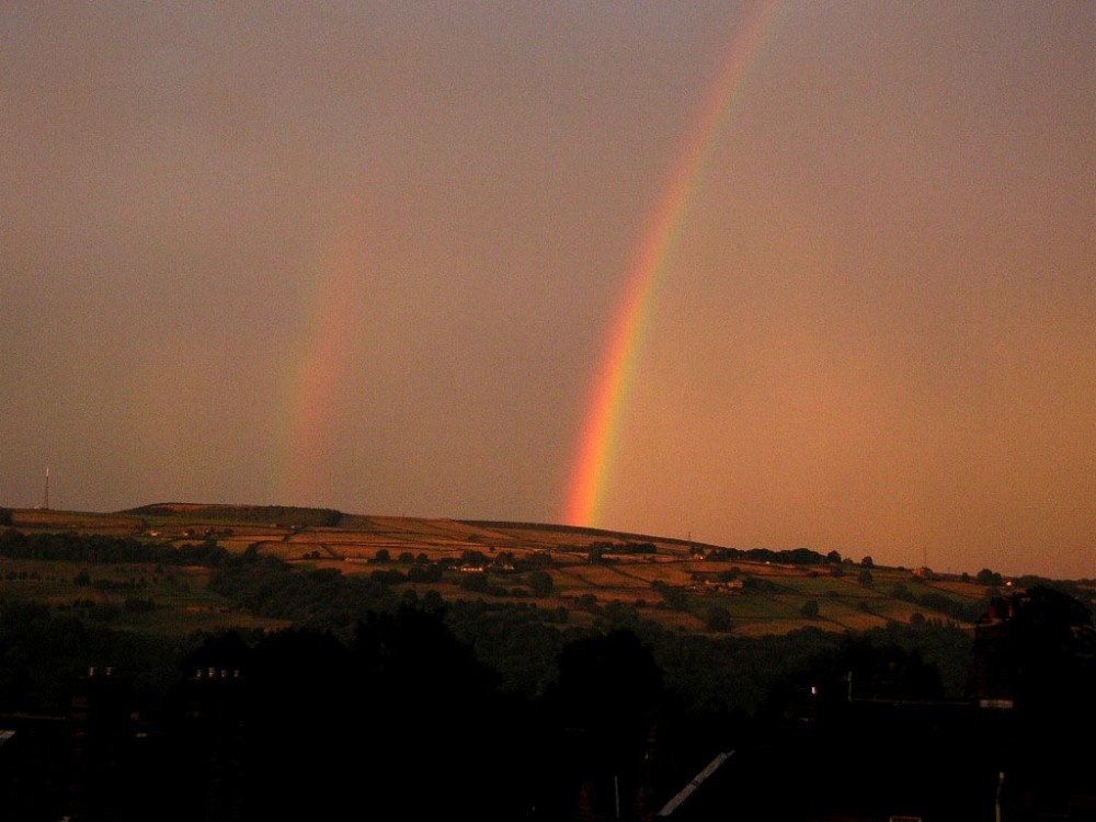 Rainbows above Ilkley Moor viewed from Utley, Keighley, West Yorkshire.