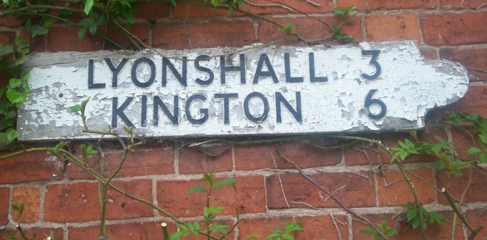 Wallmounted sign at Almeley, North Herefordshire