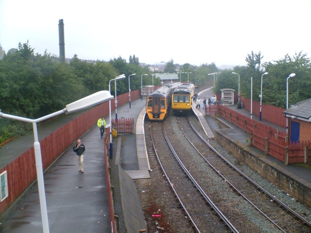 Photograph of Two passing trains at Accrington staition