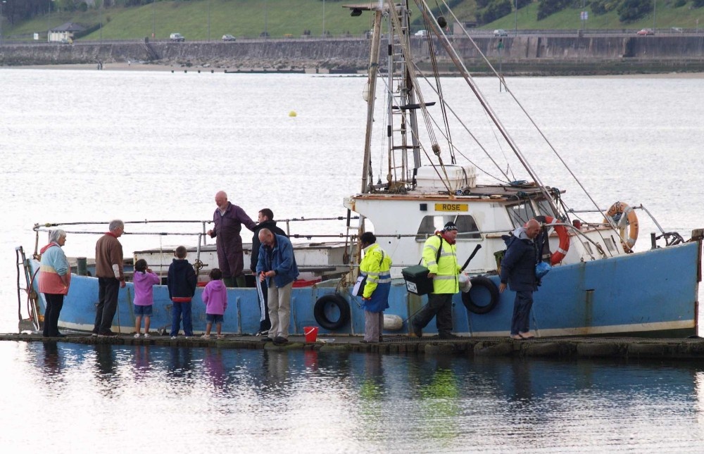 Fishing boat returning - Colwyn Bay, N Wales.