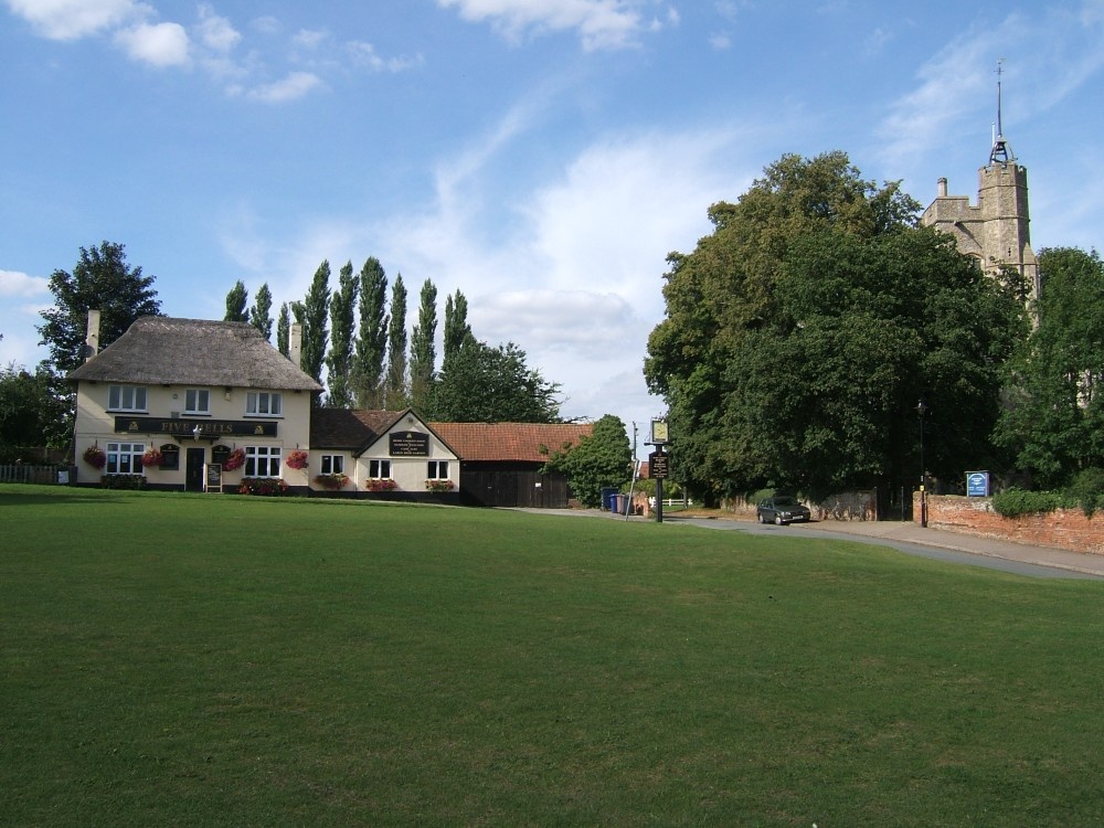 Cavendish village green looking towards The Five Bells pub and church