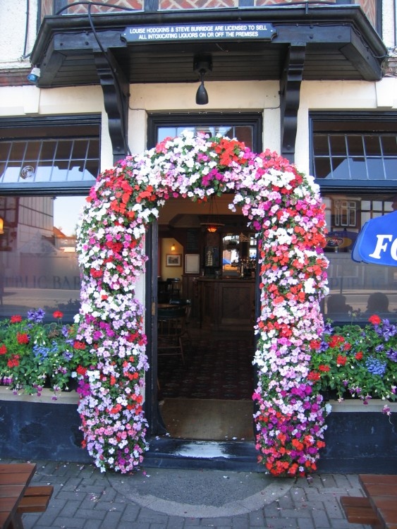 Floral entrance to the Mailman's Arms pub, Lyndhurst, Hampshire
