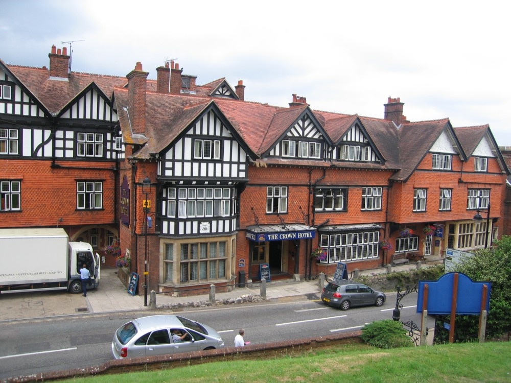 The Crown Hotel which is opposite Saint Michael and All Angels church, in Lyndhurst, Hampshire