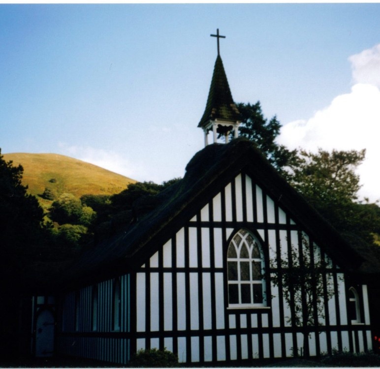 Photograph of The front of the little thatched church at Little Stretton, Shropshire