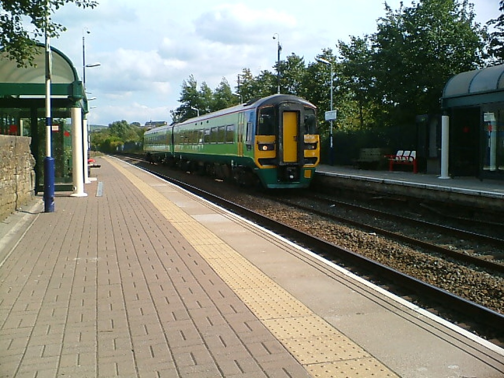 Photograph of The Leeds To Blackpool train rushes through Oswaldtwistle Station