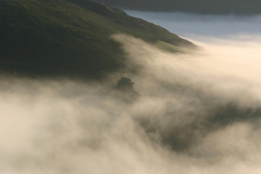 Mist at the bottom of Hallin Fell, sunrise, Ullswater, Lake District