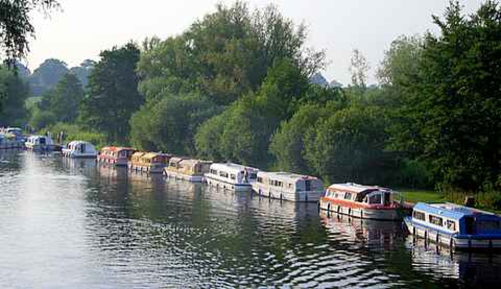 Boats Lined up along the River Bure at Wroxham, Norfolk