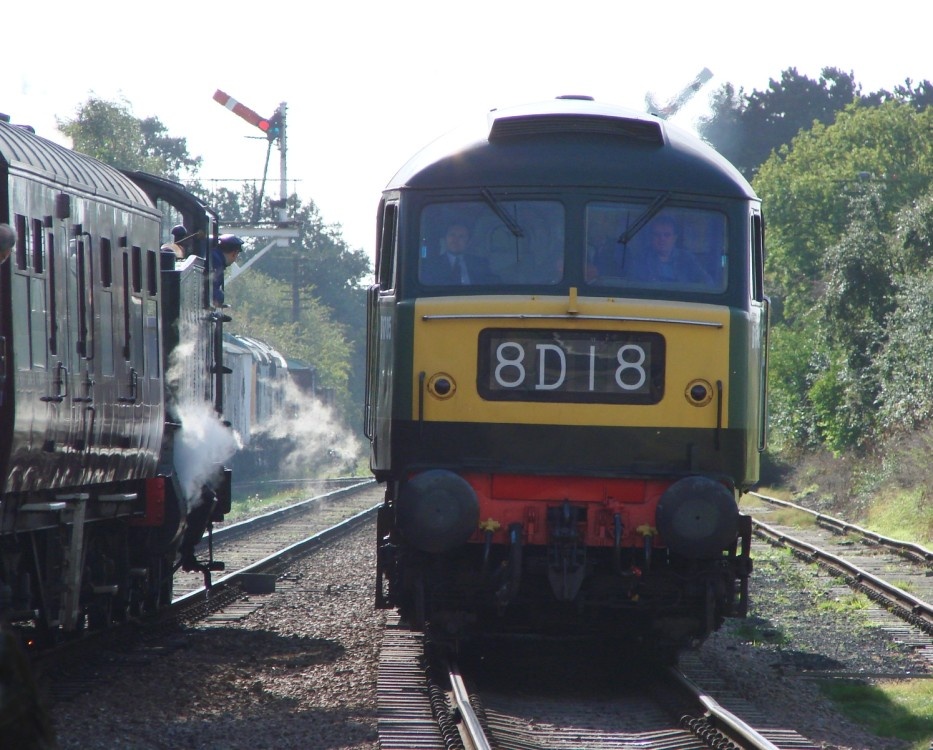 Diesel and steam pass on the Great Central Railway, Leicestershire.