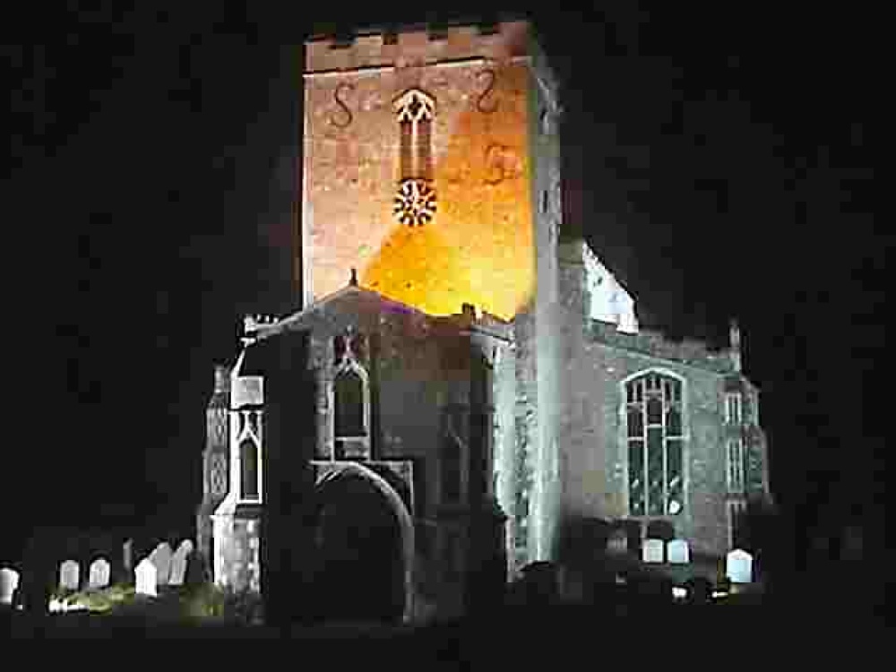 Photograph of Debenham Church lit up in a late spring evening. Debenham, Suffolk.