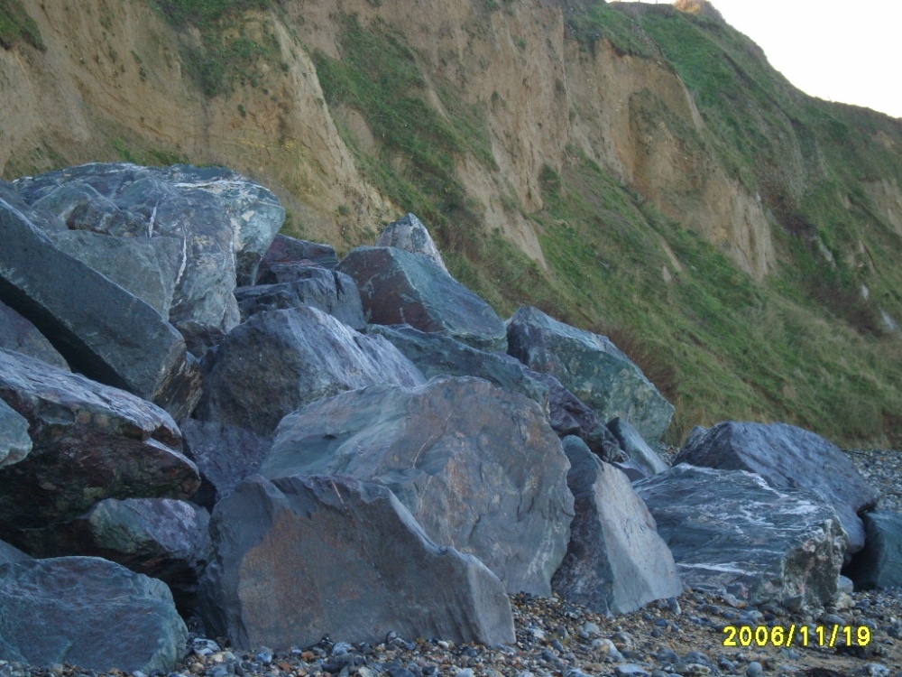 Photograph of Granite boulders placed to stem erosion of the sea cliffs at East Runton, Norfolk