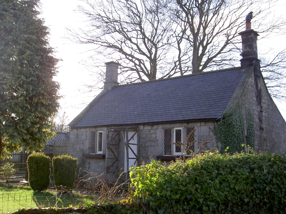 Photograph of This is the well known Bridge End Cottage situated next to Thropton bride, Thropton, Northumberland
