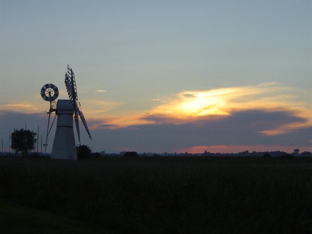 Photograph of Sunset in June at Thurne Dyke on the Norfolk Broads after a lovely day's cruising.