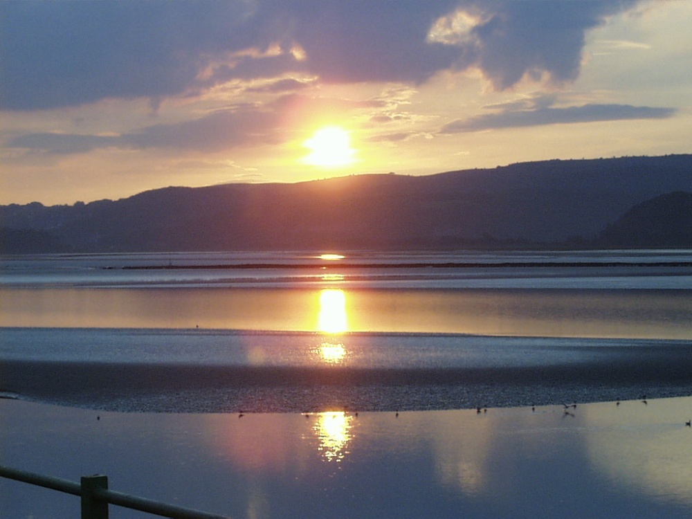 Photograph of Arnside in Cumbria, sunset over the Kent estuary, September 2006.