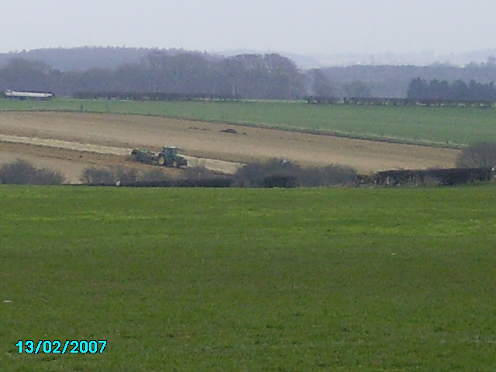Looking out of Worksop towards the North. Tractors busy in this rural area