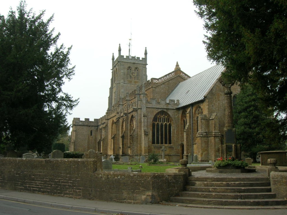 Photograph of All Saint's Church with Rememberance Day monument in foreground, Martock, Somerset