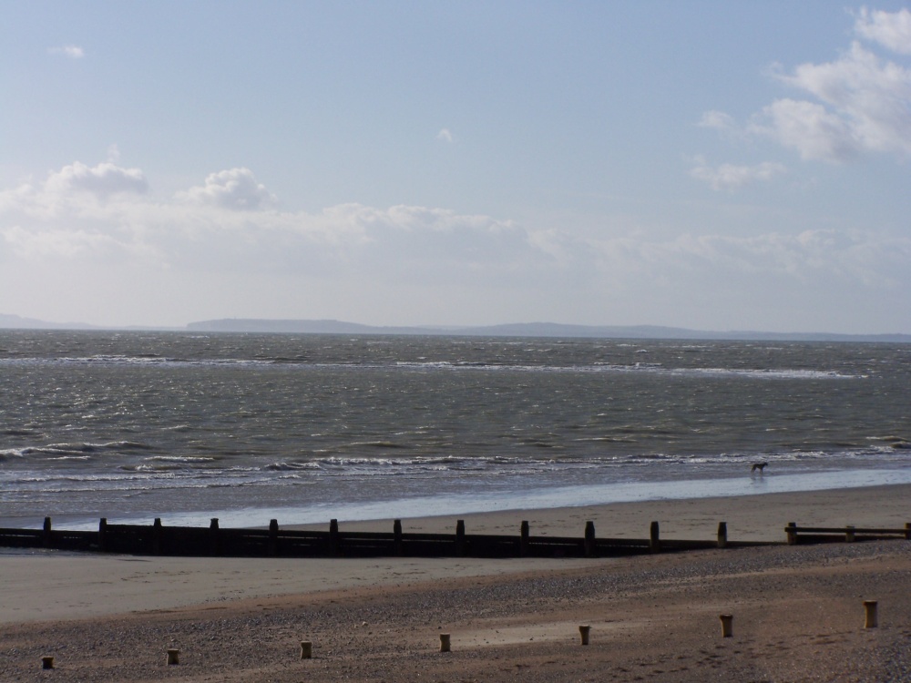 A view looking to the Isle of Wight from the beach next to bill house. Selsey, West Sussex