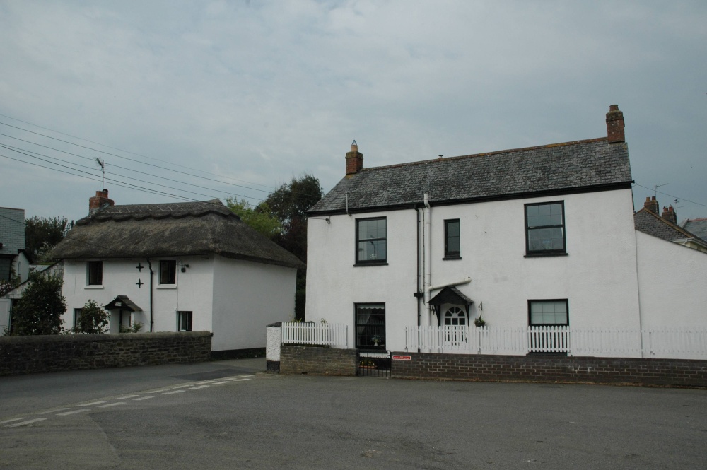 On the left of picture is Tudor cottage built in the 17th century, Stratton, Cornwall, England