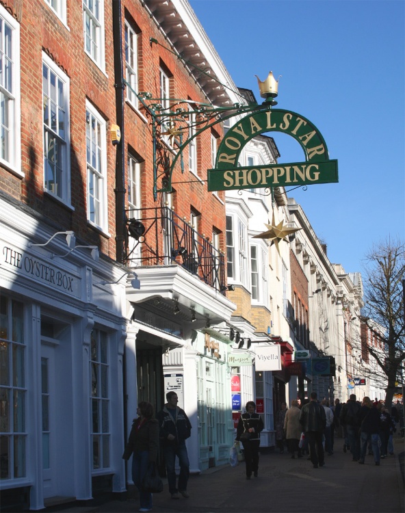 The High Street entrance to a small shopping arcade in Maidstone, Kent.