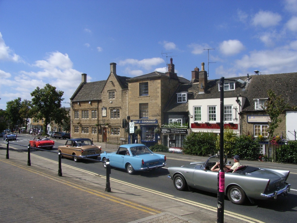 Classic cars driving through Chipping Norton