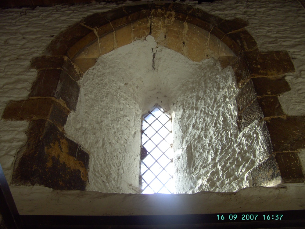 The doorway into St Peters & St Pauls Church,Owmby-by-Spital, Lincolnshire has this window inside.