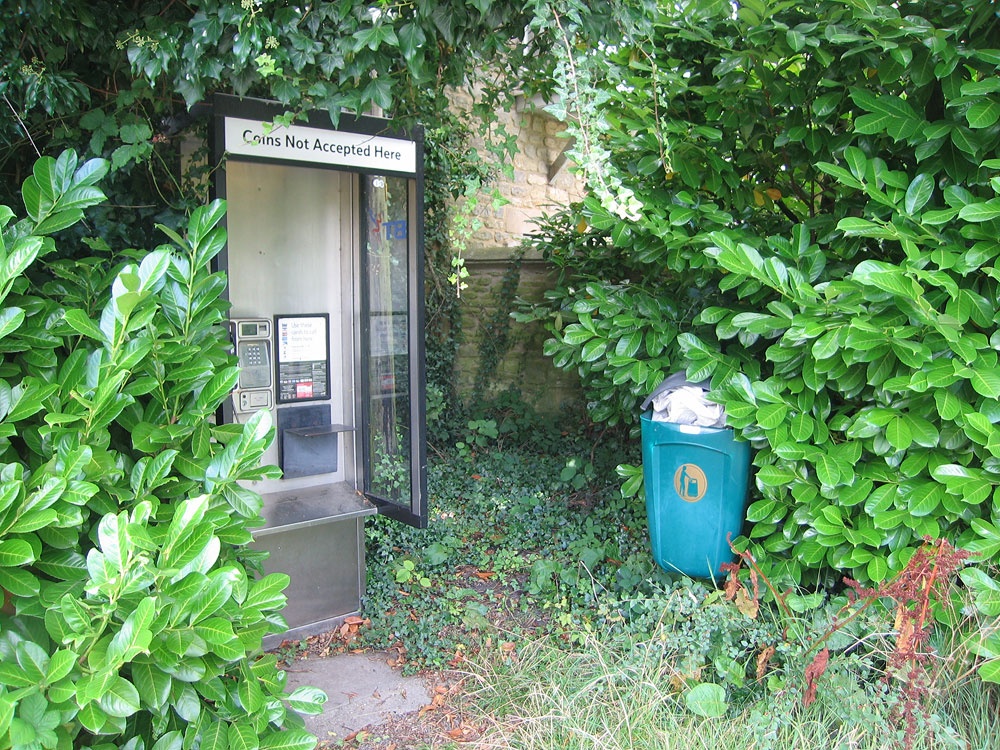 Modern phone box well hidden away in Weston on the Green