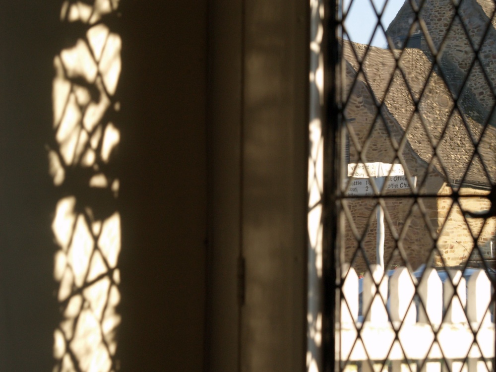 View of village green signpost from cottage, King's Sutton, Northants.