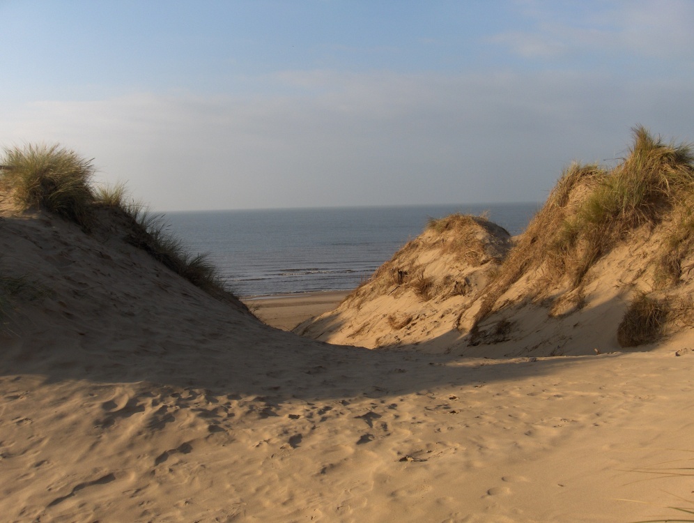 Photograph of Sun, sand, sea and shadow with a touch of blue sky - Formby coast....