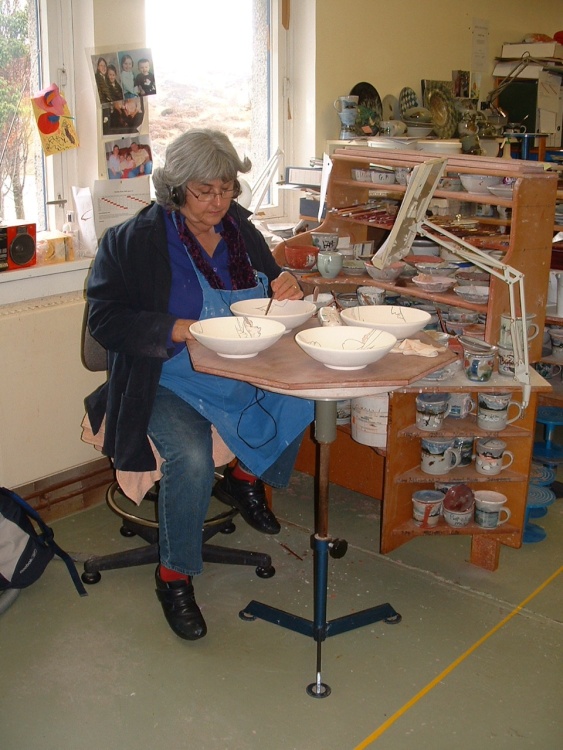 Hand painting pots, West Highland Stoneware