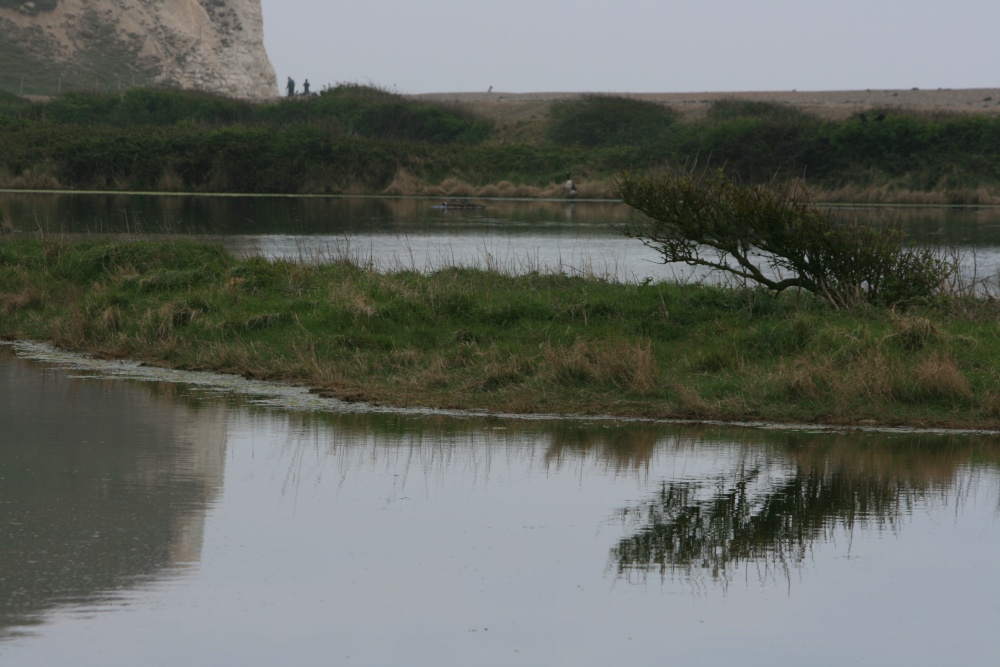 Cliffs reflected on the water