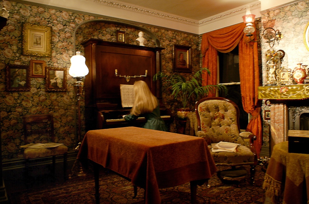 Playing the piano in the Parlour.