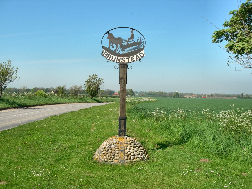 Photograph of Brumstead village sign, despite the spelling Brunstead