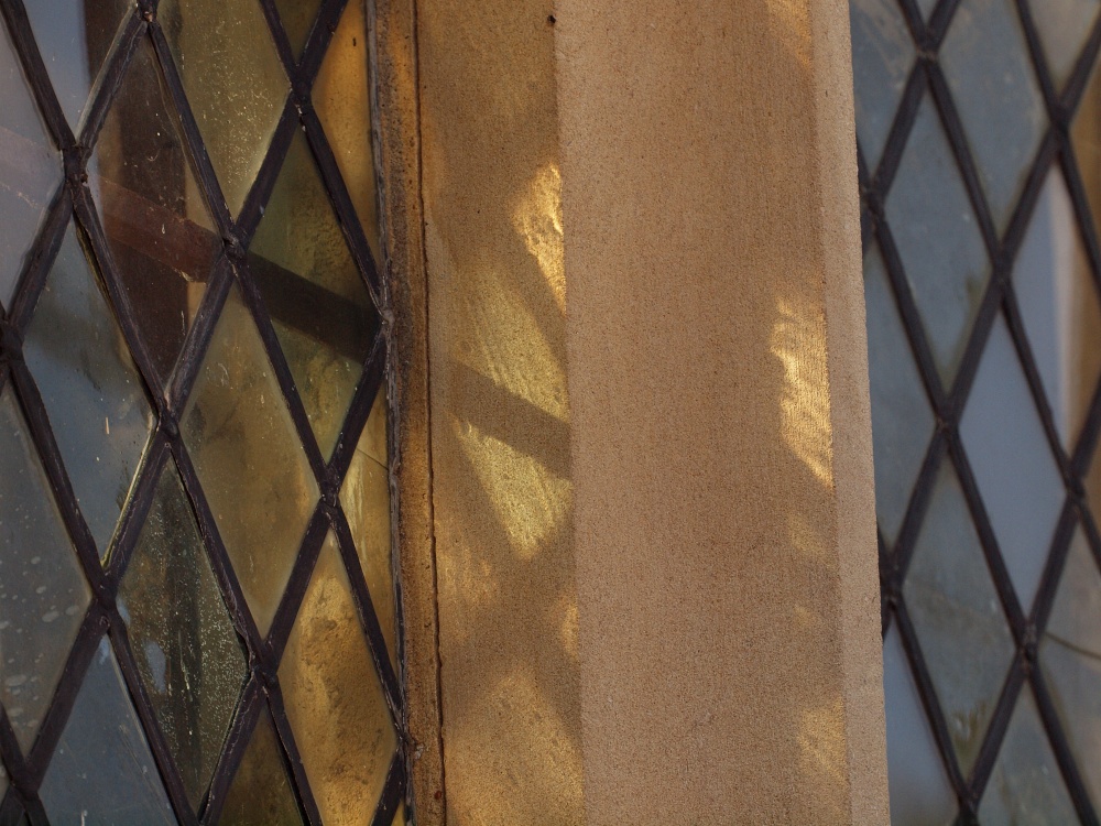 Weak sunlight through stained glass, All Saints' Church, Hillesden, Bucks
