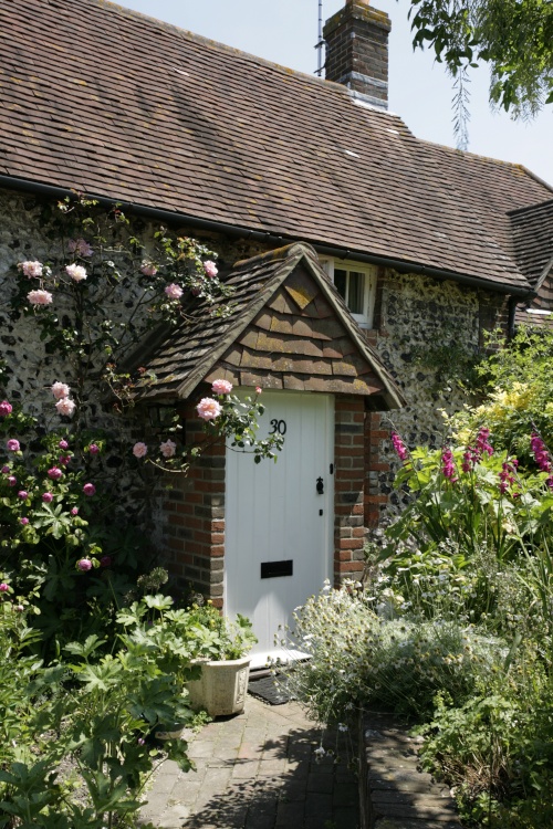 Cottage in village with flowers