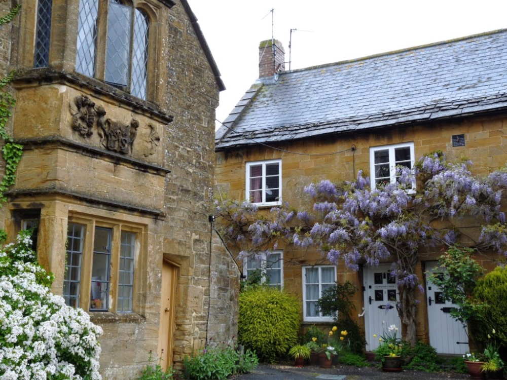 Ham stone cottage with wisteria