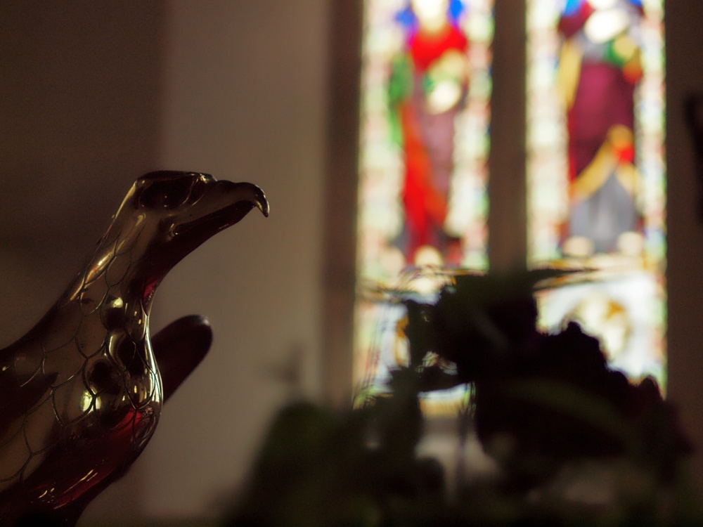 Stained glass and eagle, All Saints' Church, Mixbury, Oxon.