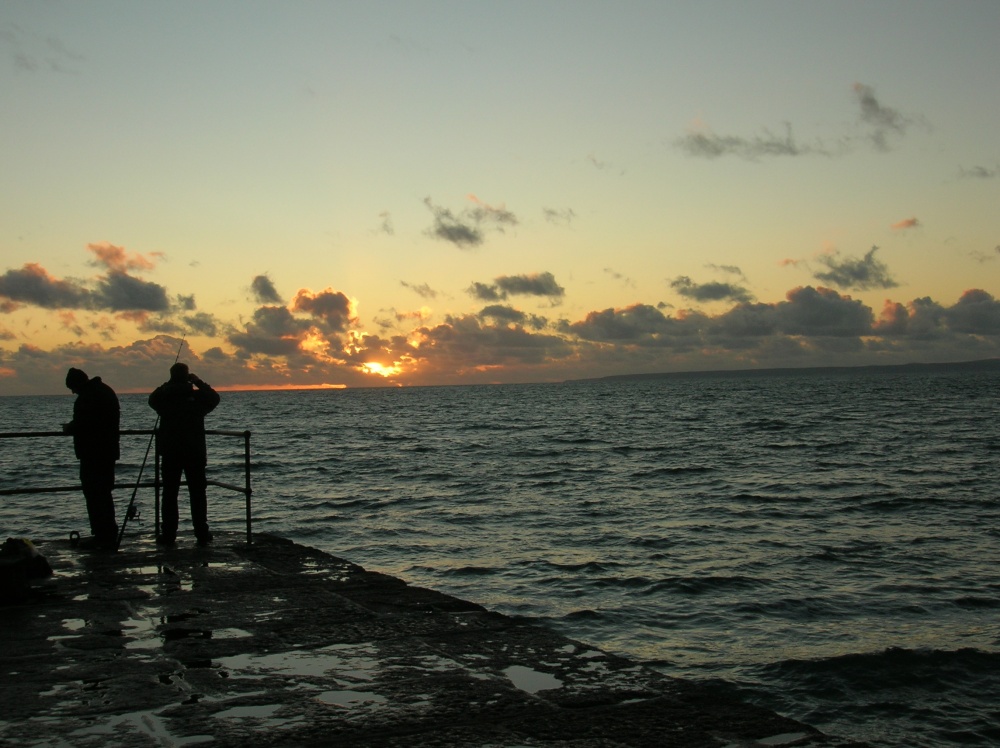 Fishermen at dusk in February