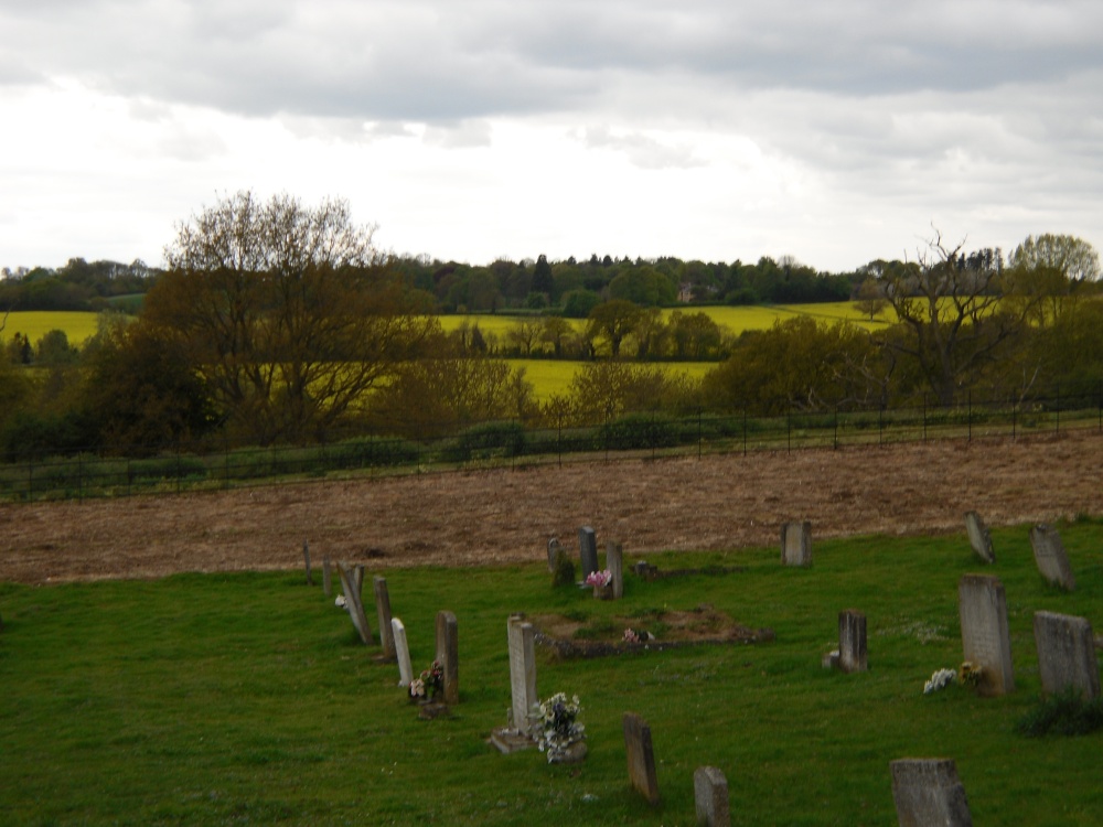 Churchyard near the Church of Holy Virgin and view on the fields in Polstead