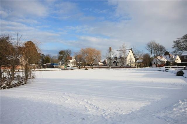 Photograph of Wootton pond in winter.