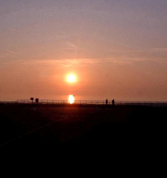 Setting Sun over Blackpool, with boat