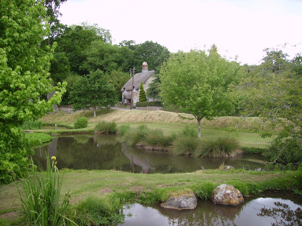 Pond and cottage at Ugbrooke House