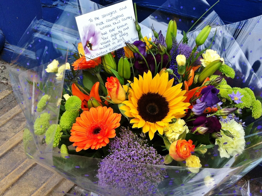 Photograph of One of many floral tributes placed outside the birthplace of Margaret Thatcher in Grantham
