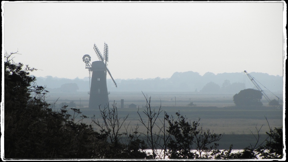 The old mill stands sentinel in the evening light. photo by Robin Keightley