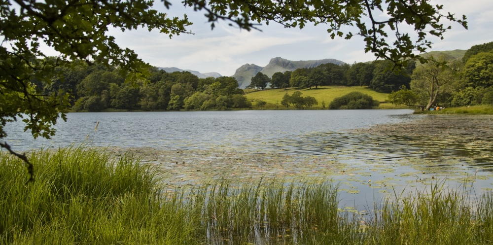 Loughrigg Tarn and Pikes photo by Dave John