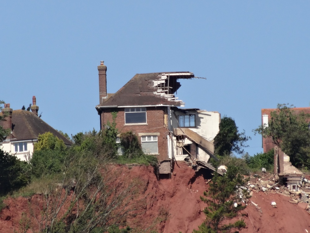 Photograph of House split in half due to a landslide