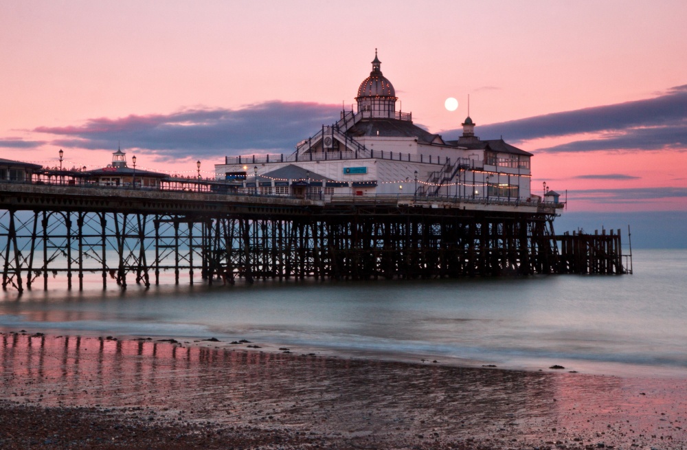 Photograph of Moon over Eastbourne pier