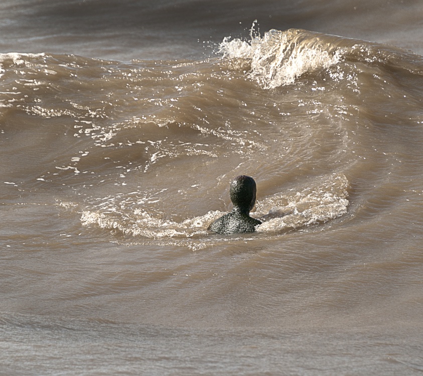 Photograph of Iron Man facing the tide at Crosby