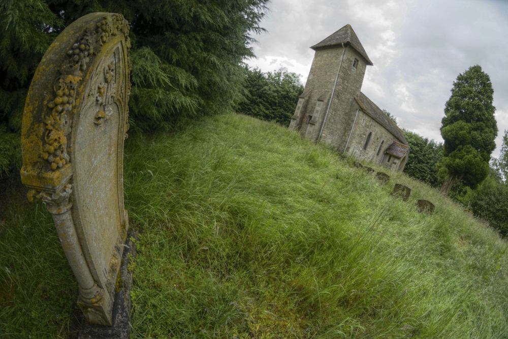 Photograph of Headstone and Church at Godington, Oxfordshire