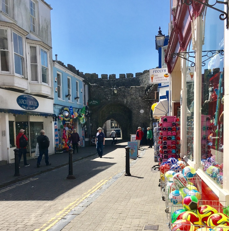 Tenby, shopping street and castle.