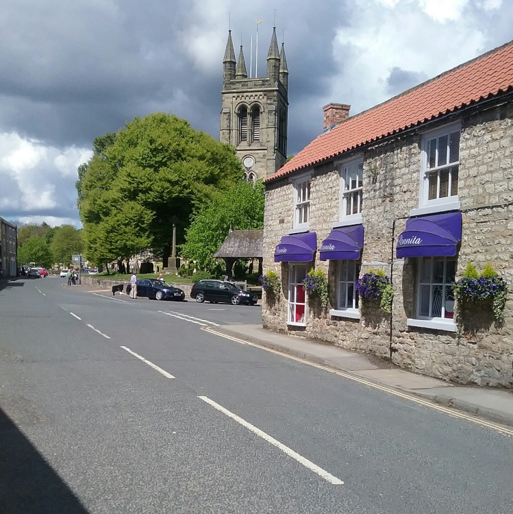 All Saints' parish church, Helmsley, looking radiant in glorious summer sunshine.